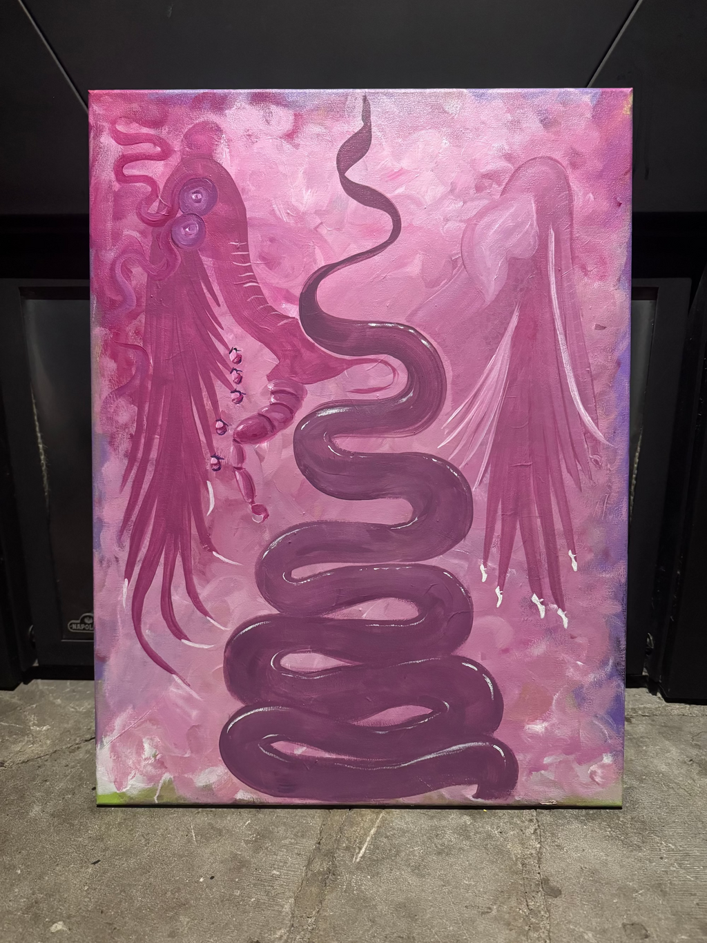 A vertical canvas painting featuring a dark purple coiled serpent and a pink winged creature.